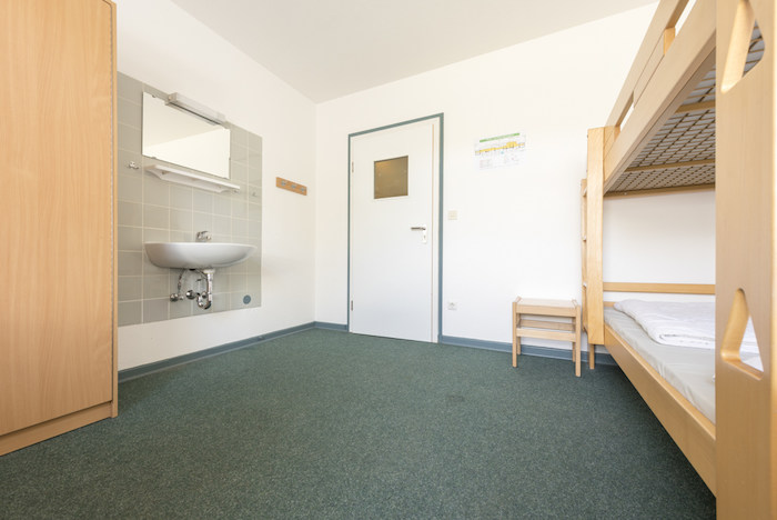 Ein Schlafzimmer im Kreativcamp Tanzen an der Ostsee