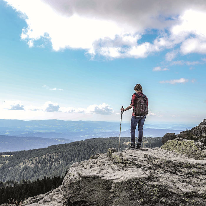 A girl from the Summer Camps Germany is on a hike 